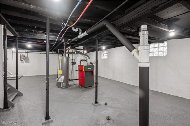 basement with gas water heater and a heating unit