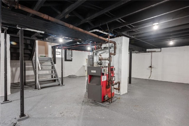 basement with stairs, electric panel, and a heating unit