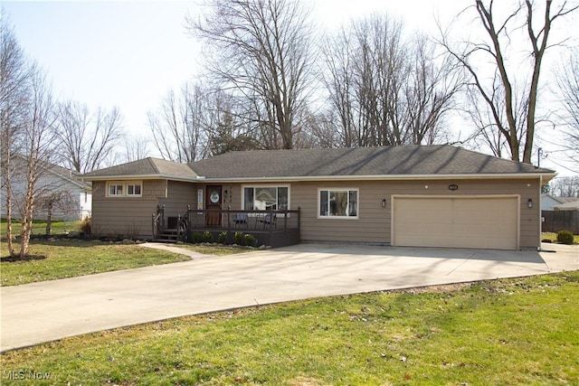 ranch-style house with concrete driveway, an attached garage, a front lawn, and a wooden deck