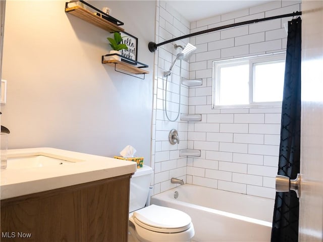 bathroom with shower / bathtub combination with curtain, toilet, and vanity