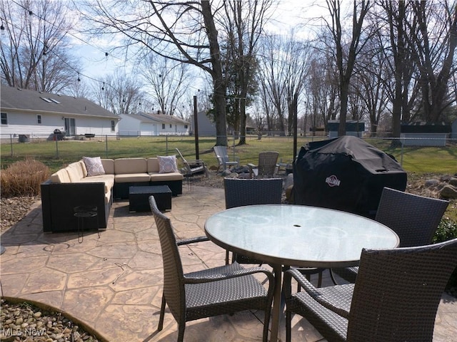 view of patio with outdoor lounge area, area for grilling, outdoor dining space, and fence