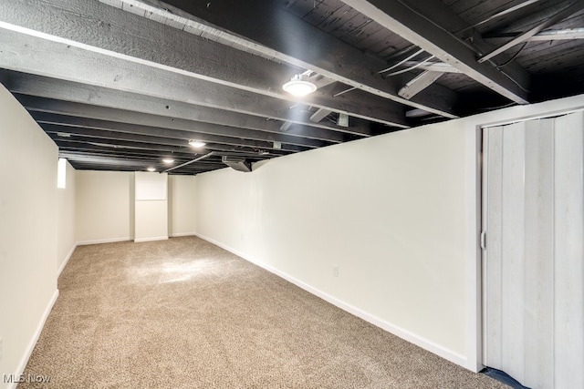 finished basement with baseboards and carpet floors