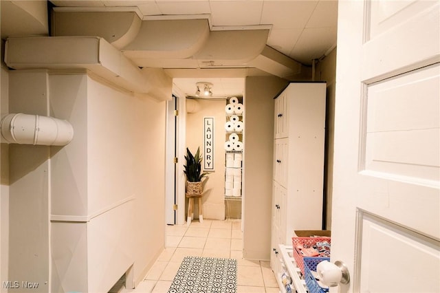 corridor with light tile patterned floors