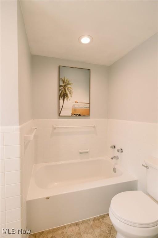 full bath with a bath, recessed lighting, and toilet