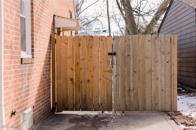 view of gate featuring fence