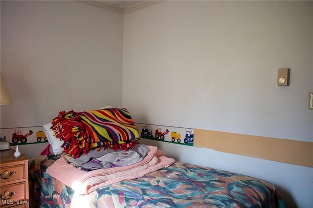 bedroom with ornamental molding