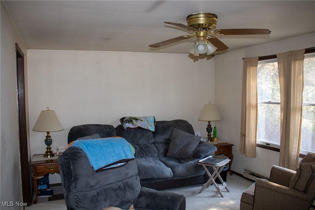 carpeted living room featuring a baseboard heating unit