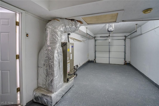 garage featuring baseboards and a garage door opener