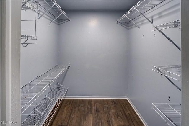 spacious closet with wood finished floors