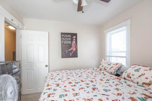 carpeted bedroom with ceiling fan