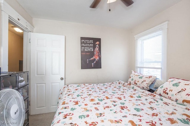 carpeted bedroom featuring a ceiling fan