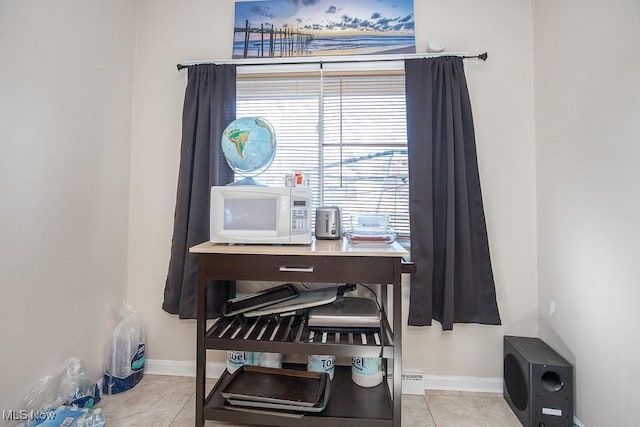 details featuring white microwave and baseboards