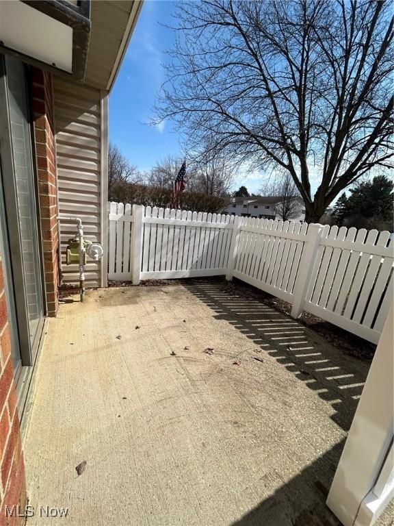 view of patio featuring fence