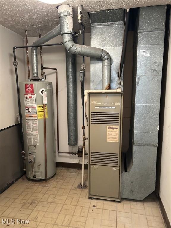 utility room featuring water heater