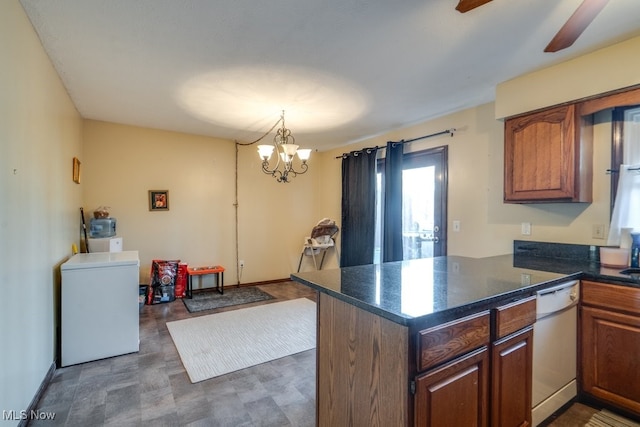 kitchen with brown cabinets, pendant lighting, fridge, a peninsula, and white dishwasher