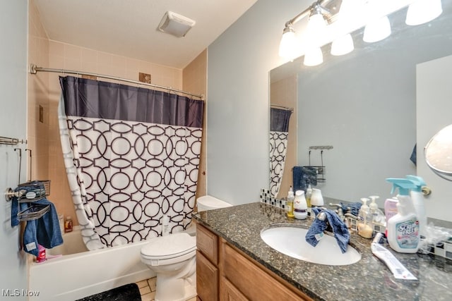 full bath featuring vanity, tile patterned floors, shower / tub combo, and toilet