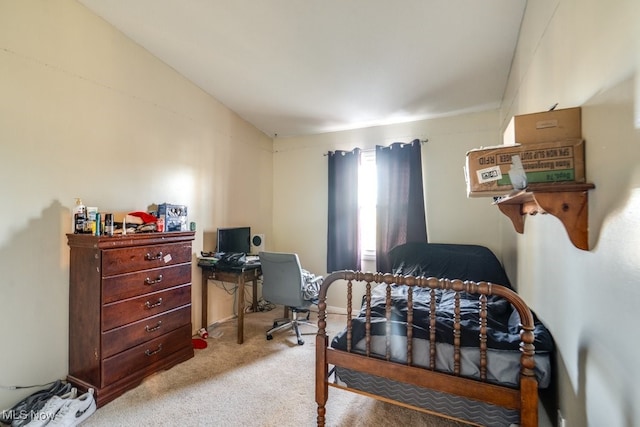 bedroom with lofted ceiling and light colored carpet