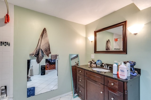 full bath with tile patterned floors and vanity