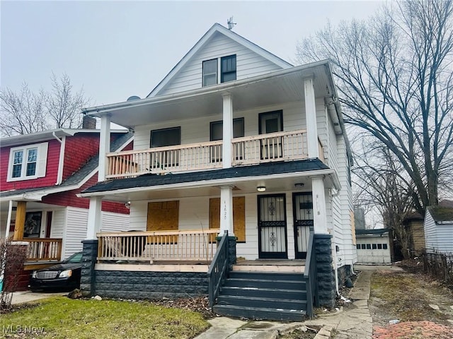 view of front of property with a balcony and covered porch