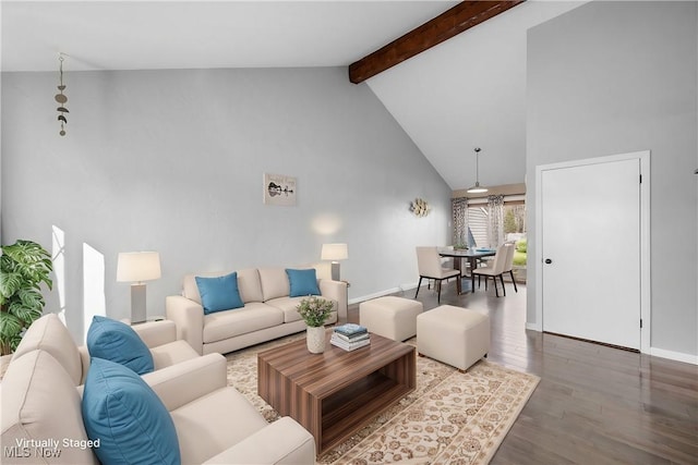 living area with beamed ceiling, wood finished floors, baseboards, and high vaulted ceiling