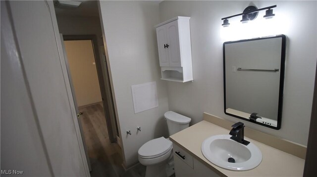 355 Village Pointe Dr Unit 1-A, Akron, OH 44313 - bathroom with toilet, vanity, and wood finished floors