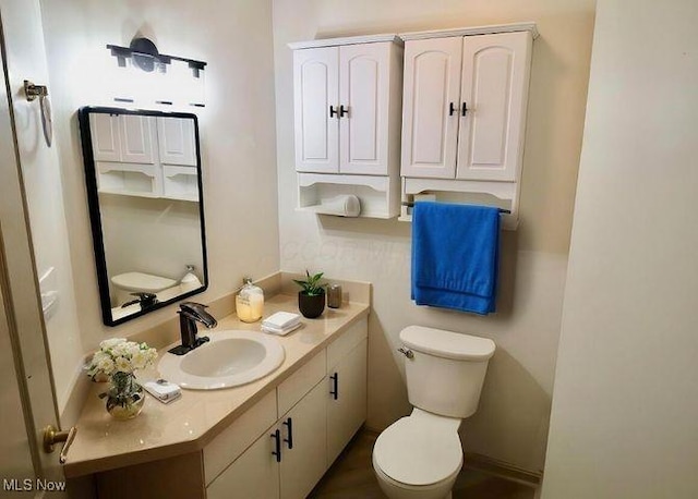 355 Village Pointe Dr Unit 1-A, Akron, OH 44313 - bathroom featuring toilet and vanity