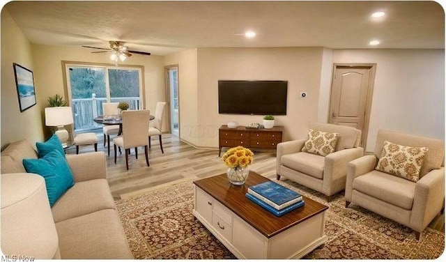 living area with a ceiling fan, recessed lighting, and light wood-style floors