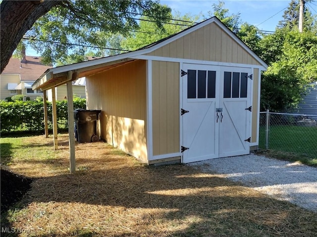 view of shed with fence