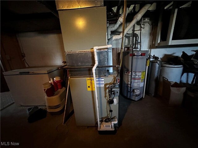 utility room featuring gas water heater