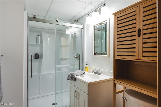 full bath featuring vanity, toilet, and a stall shower