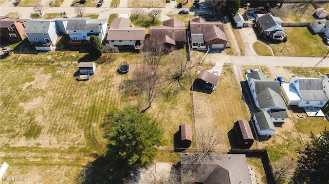 birds eye view of property with a residential view