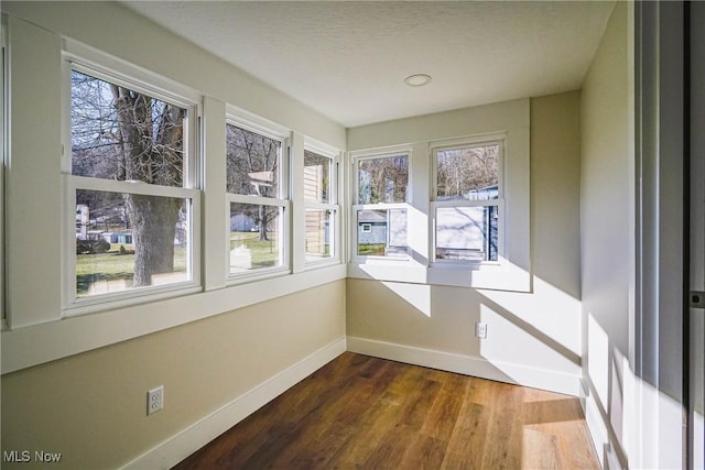 unfurnished sunroom with a wealth of natural light