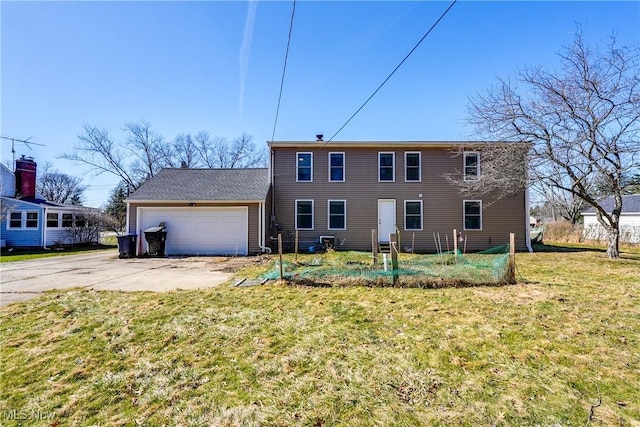 view of front facade with concrete driveway, a garage, and a front yard