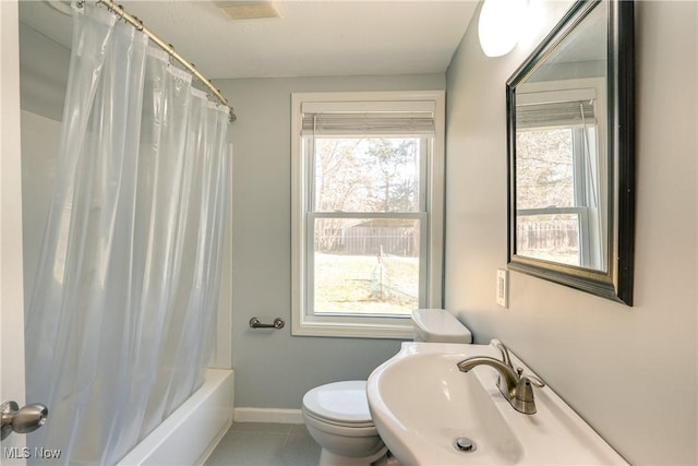 full bath with visible vents, baseboards, a sink, tile patterned flooring, and toilet