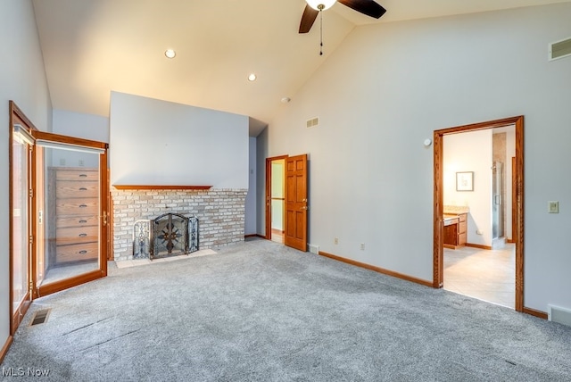 unfurnished living room featuring visible vents, light colored carpet, and a brick fireplace