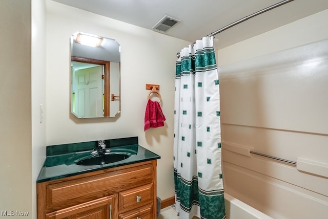 full bath featuring visible vents, vanity, and shower / bath combination with curtain