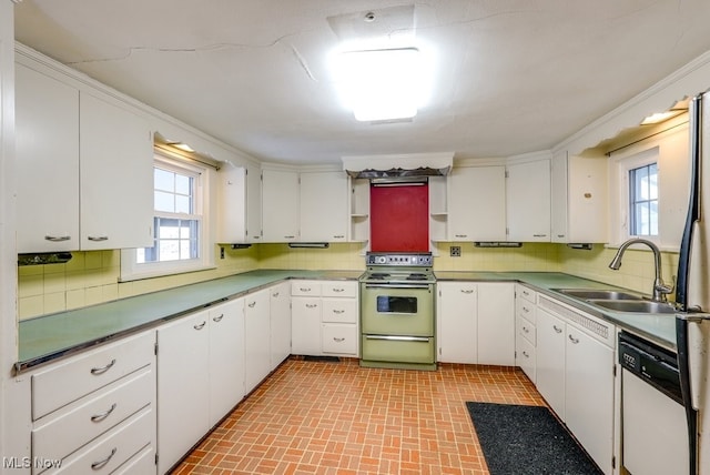 kitchen featuring range with electric cooktop, a sink, white cabinetry, decorative backsplash, and dishwasher