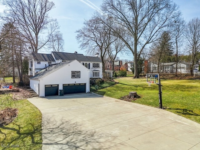 view of property exterior featuring a lawn, concrete driveway, and an attached garage