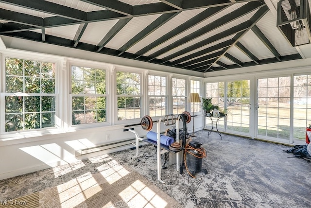 sunroom / solarium featuring lofted ceiling with beams