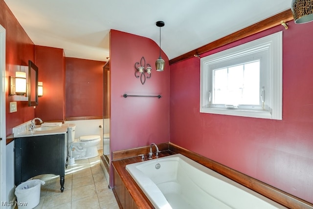 full bathroom with tile patterned flooring, toilet, vanity, and a garden tub