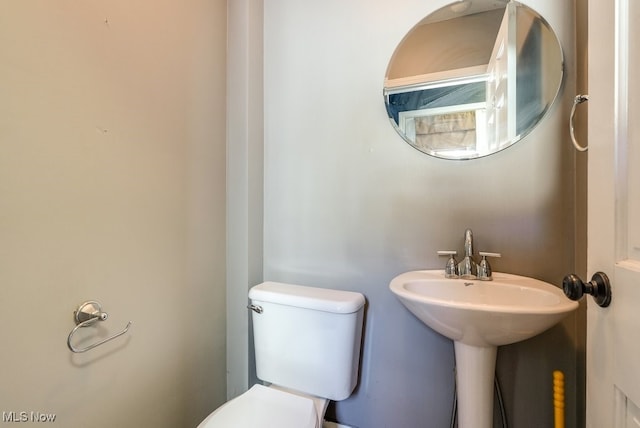 bathroom with a sink and toilet