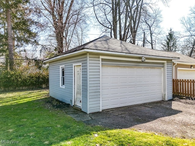 detached garage with fence