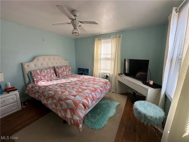 bedroom with ceiling fan and wood finished floors