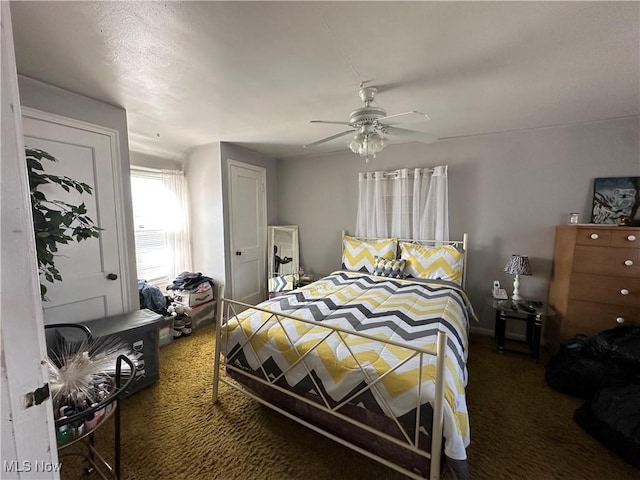 carpeted bedroom with a ceiling fan