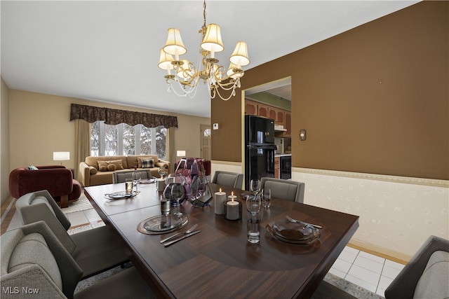 dining space with tile patterned floors, wine cooler, an inviting chandelier, wallpapered walls, and baseboards