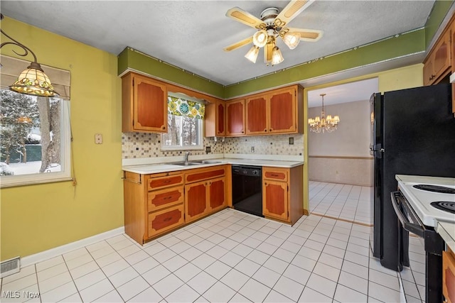 kitchen with visible vents, dishwasher, light countertops, ceiling fan with notable chandelier, and white electric range