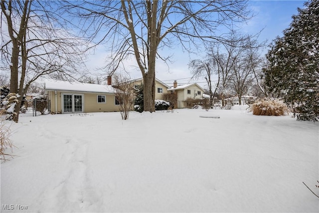 view of yard layered in snow