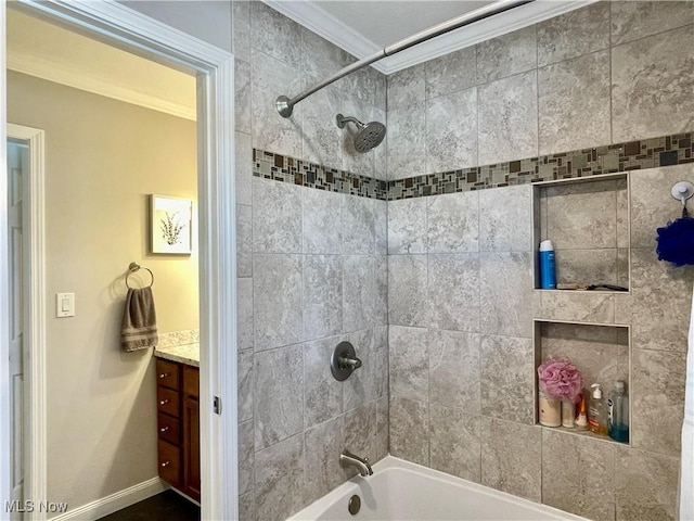 full bathroom with baseboards, vanity, bathtub / shower combination, and ornamental molding