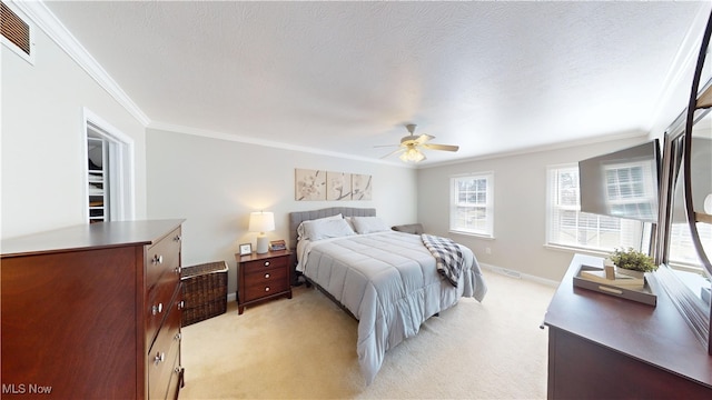 bedroom featuring visible vents, light carpet, a textured ceiling, and ornamental molding