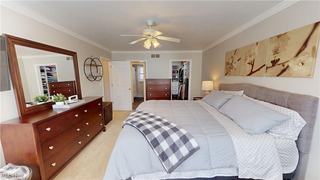 bedroom featuring visible vents, ornamental molding, a spacious closet, a closet, and light colored carpet